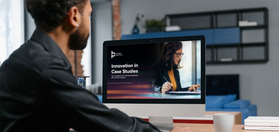 man looking at Innovation in Case Studies on computer